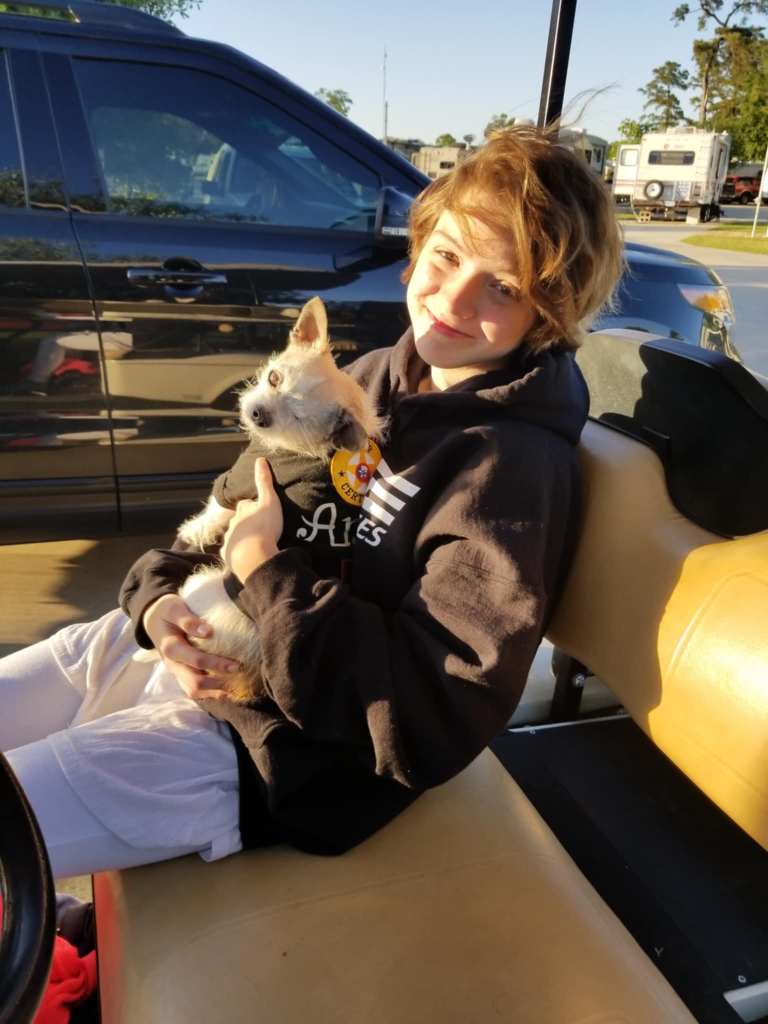 Adoptable dog in Alberta getting some cuddles